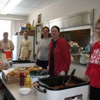 Volunteers serving food at St. Bridget's Catholic Church